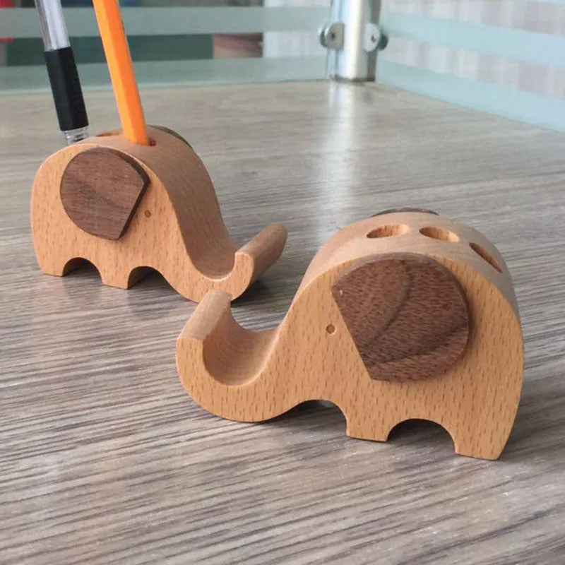 A decorative resin mobile phone stand holding a smartphone, shown in an animal design variant.