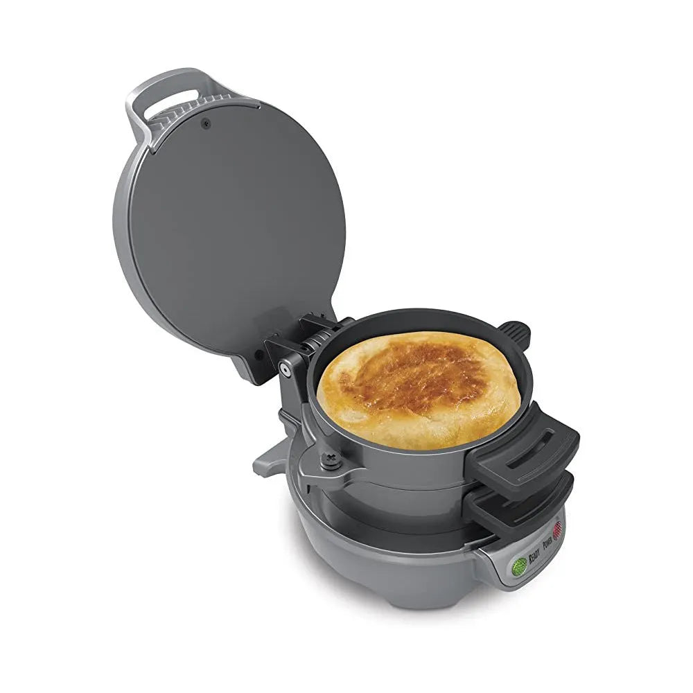 Mechanical breakfast machine in silver grey with two baking trays and egg cooking ring