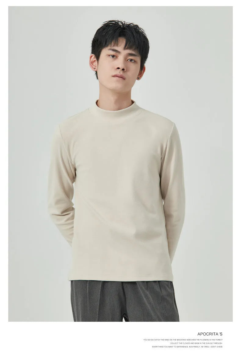 Man wearing a beige Dralon long sleeve T-shirt with a half-high collar, casual autumn outfit.