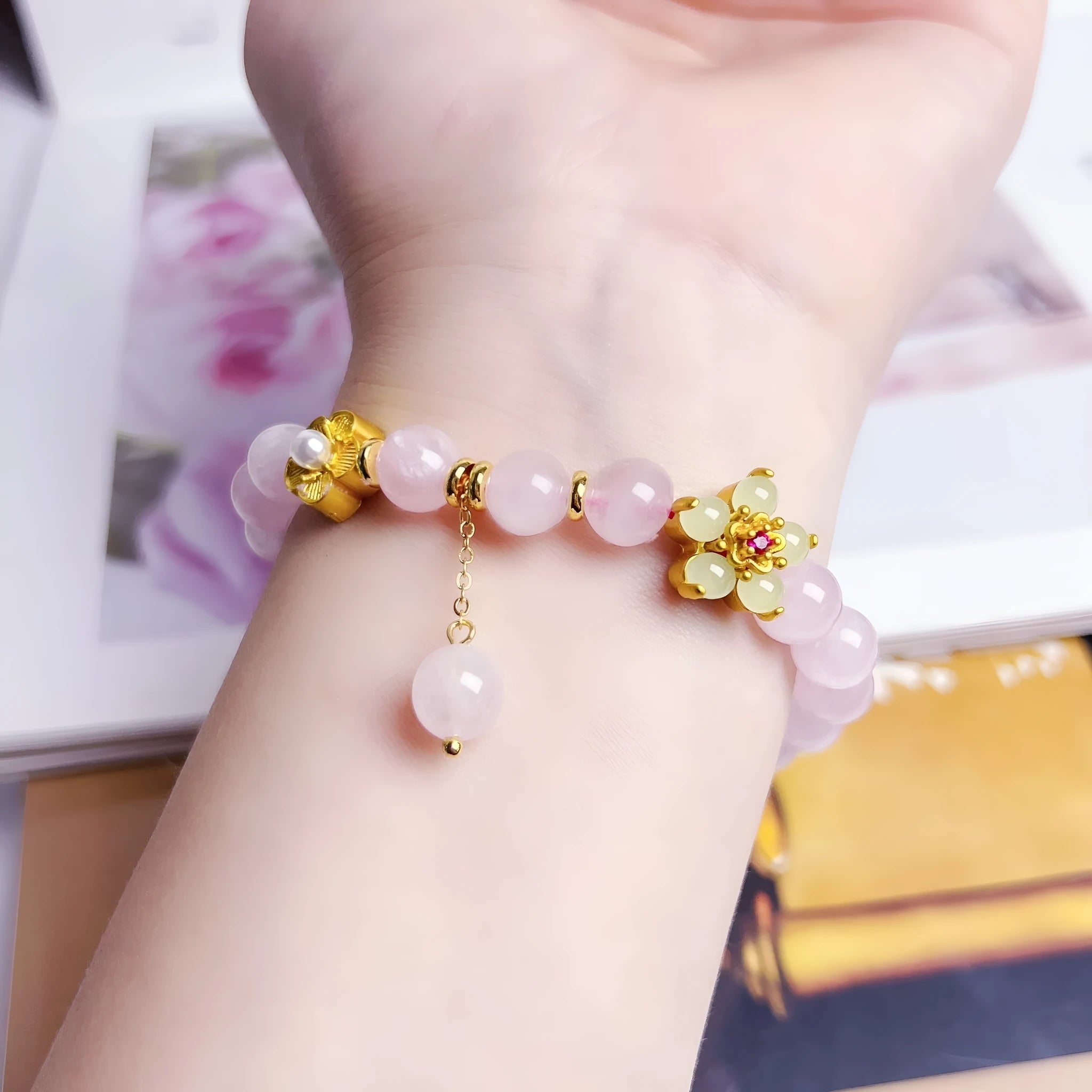 Pink crystal NAFU Peach Blossom bracelet for women on wrist.