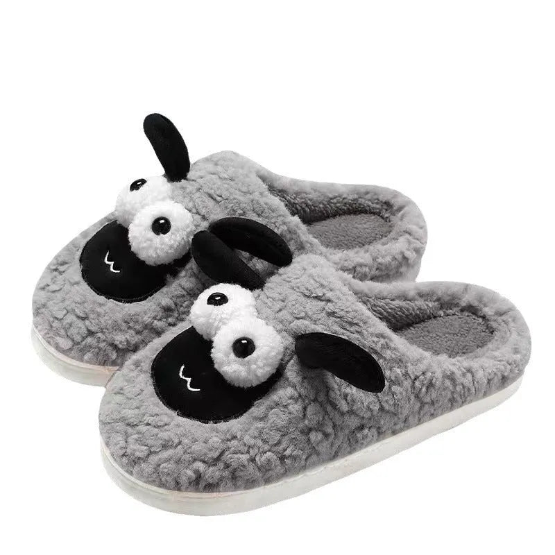 Brown slip-on slippers with suede upper and lamb thermal cotton lining on wooden floor