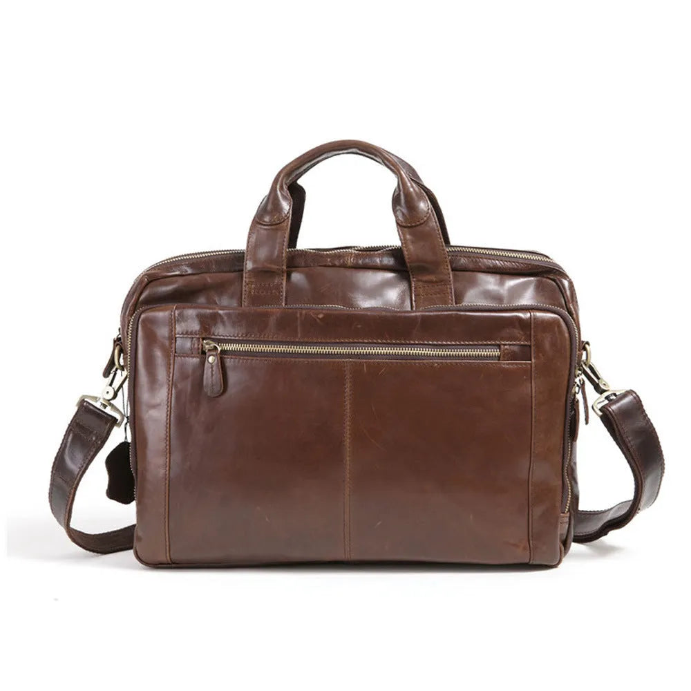 Brown leather business briefcase with visible cowhide pattern, measuring 18 inches with internal polyester cotton lining