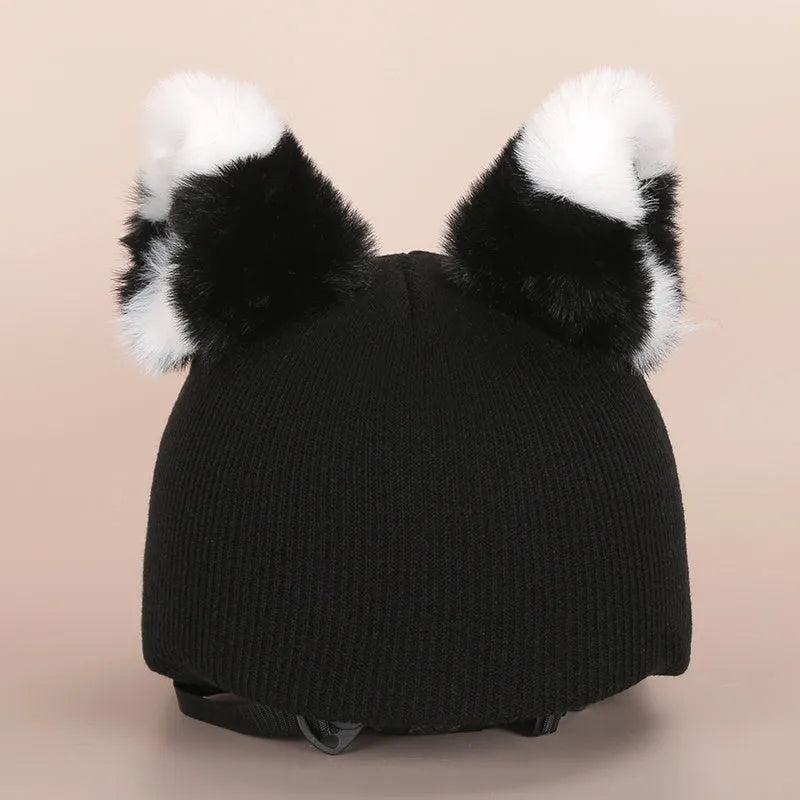 Plush fabric ski helmet decoration cover in a colourful cartoon character style.