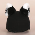 Plush fabric ski helmet decoration cover in a colourful cartoon character style.