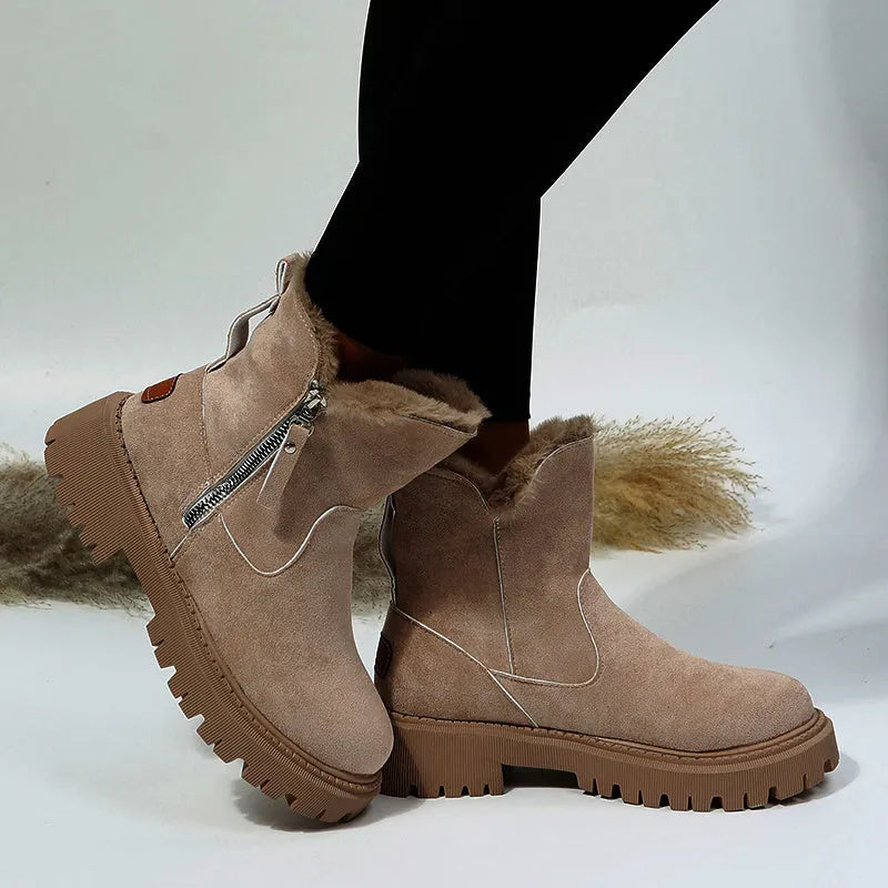 Women's black high-top faux suede snow boots with side zip and thick plush lining on a rubber sole.