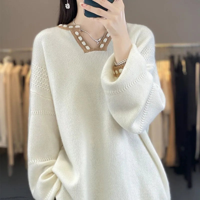 Women's camel coloured V-neck long sleeve pullover sweater made from viscose fibre fabric.
