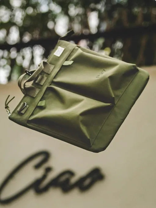 Marden Tooling canvas crossbody bag in military green with laptop compartment showing retro styling