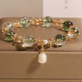 Women's green phantom quartz crystal bracelet with champagne crystals and pearl accents in Japanese-Korean style