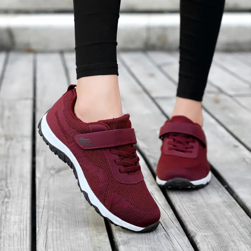 Women's low-top grey purple wedge heel casual shoes with velcro strap on soft mesh upper.