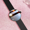 Women's smart watch with circular colour screen and metal strap on wrist