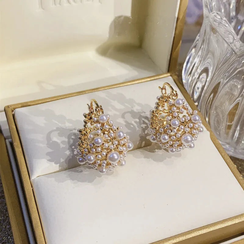 Gold colour women's flower basket earrings with copper construction and rice-shaped bead inlay