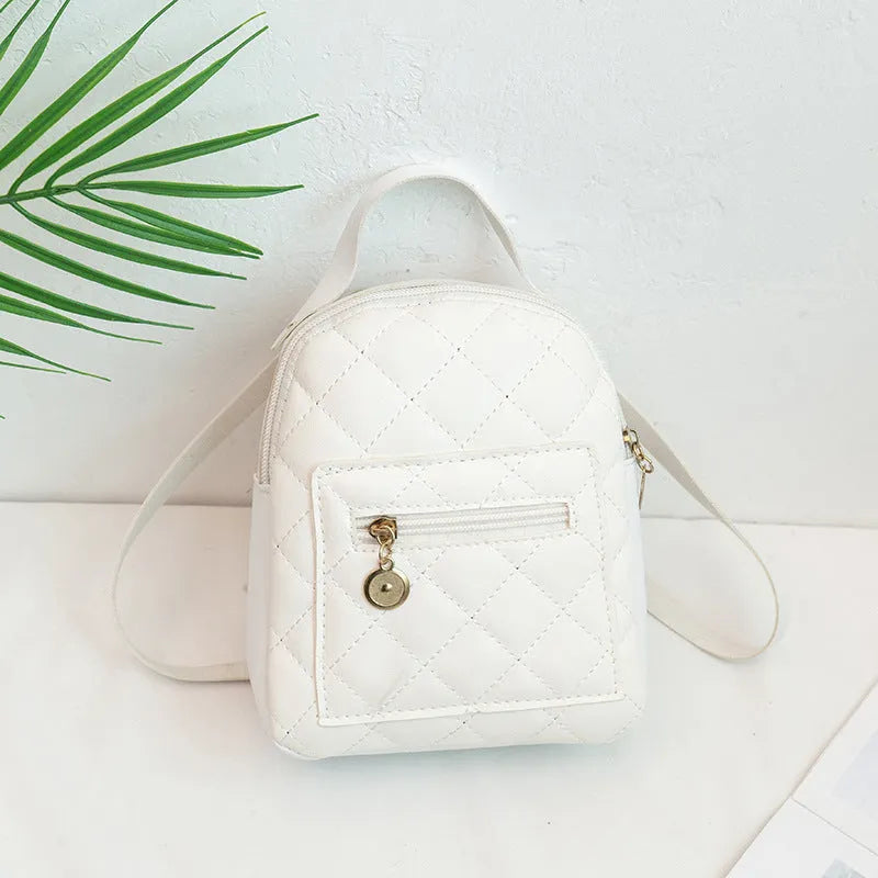Hard square vertical girls' backpack in PU with embroidery, showing front sandwich pocket and soft carry handle.