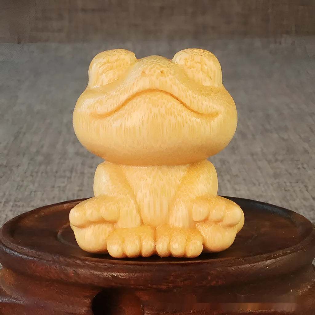 Solid bamboo smiling frog carving ornament measuring 5cm high with cartoon design