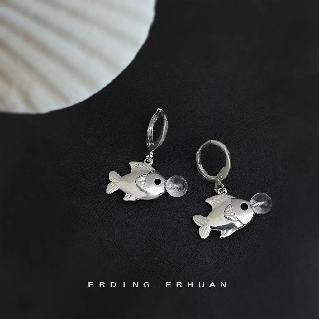 A pair of original design Bubble Fish earrings made from copper with an electroplated finish, featuring goldfish animal modelling.