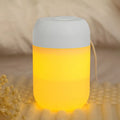 White cylindrical USB mini humidifier with mist output and charging cable
