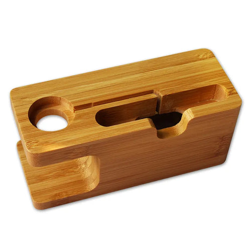 Bamboo phone and watch stand with carved design measuring 149mm wide