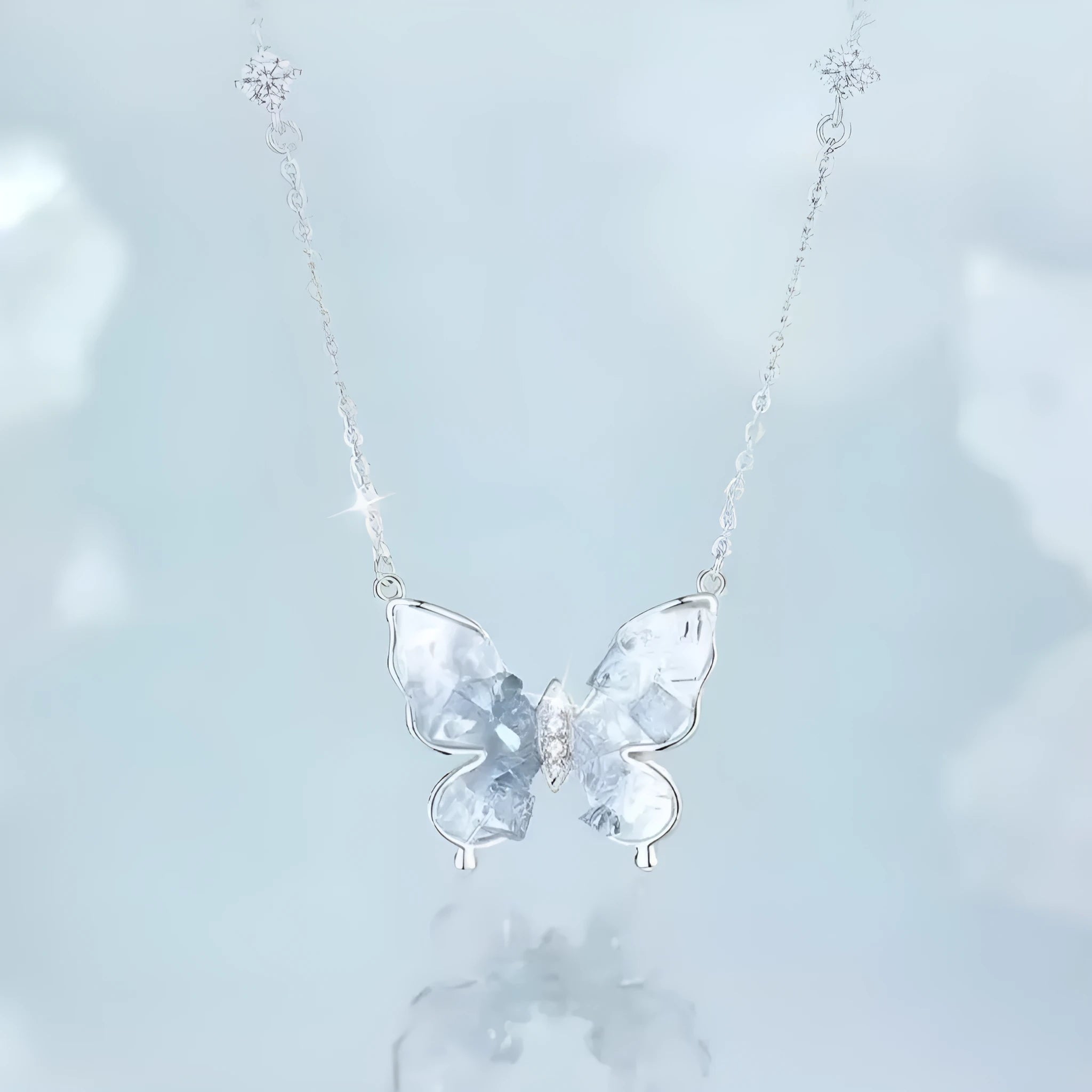 Close-up of a silver Bingyu butterfly pendant necklace on an adjustable O-ring chain.