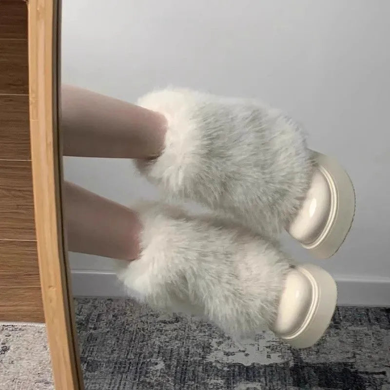 Women's black snow boots with fleece lining, waterproof platform, and rubber sole on a white background