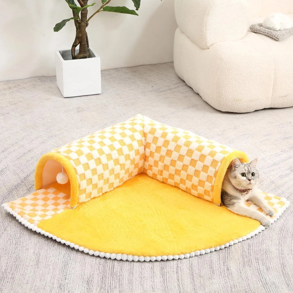 XL sized fan-shaped plush pet bed with an attached tunnel in coffee colour on a wooden floor.