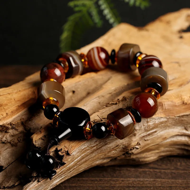Old agate bracelet with A13 sardonyx bead, white agate spacers, and red agate barrel bead in geometric ethnic design