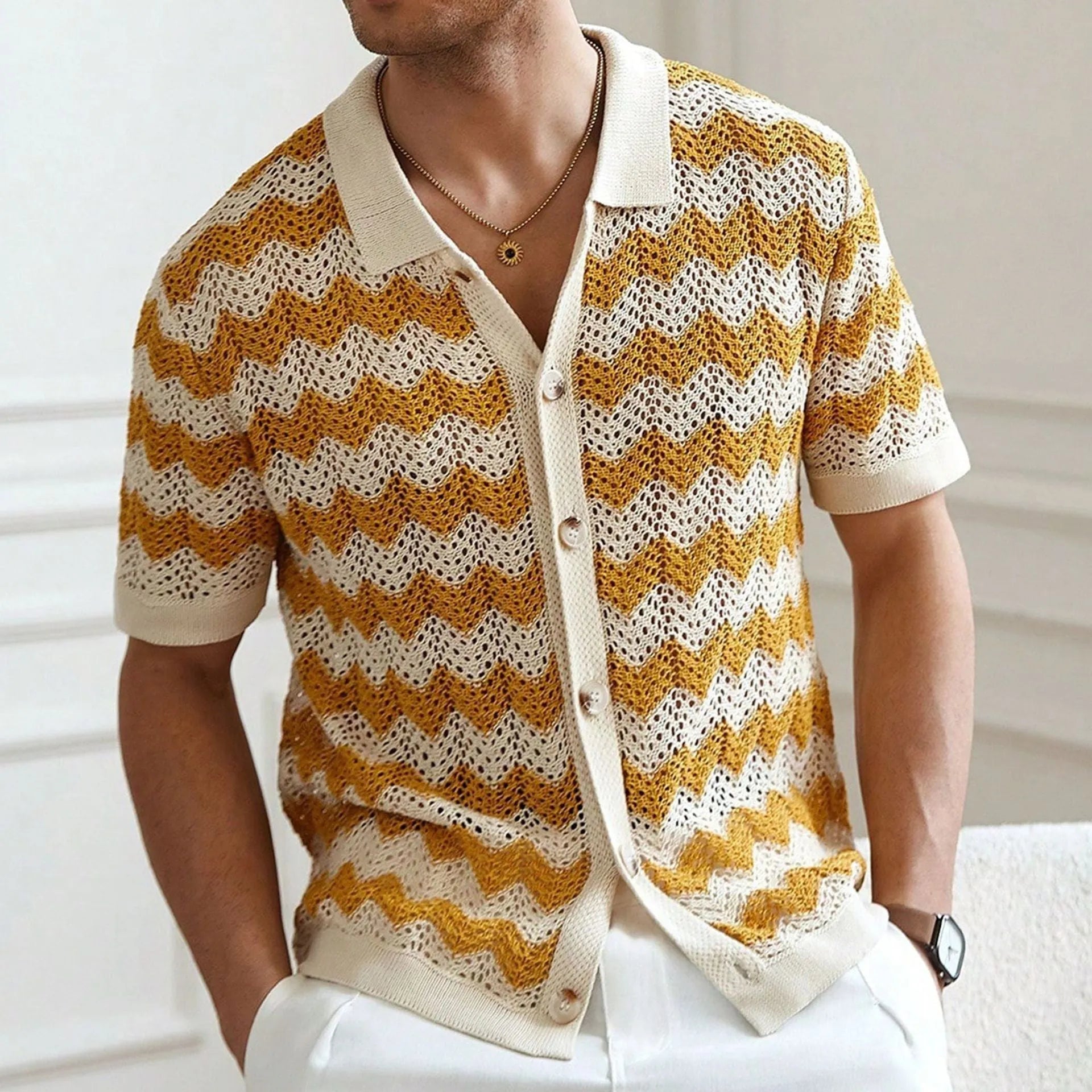 Short sleeve corrugated knit sweater in blue, brown, or yellow, showing textured jacquard pattern.