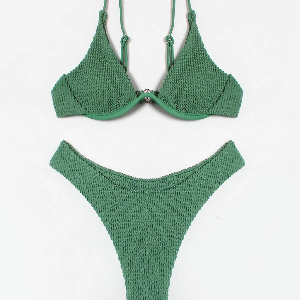 Green women's bikini set with ruffle trim, showing top and split briefs made from quick-dry polyester fabric.