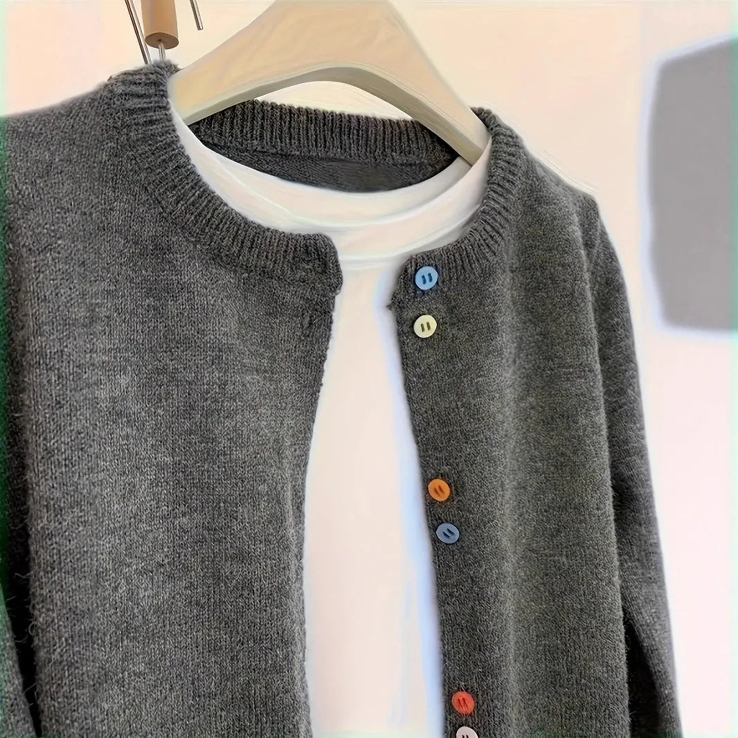 Dark grey women's button-front cardigan sweater with long sleeves on a hanger