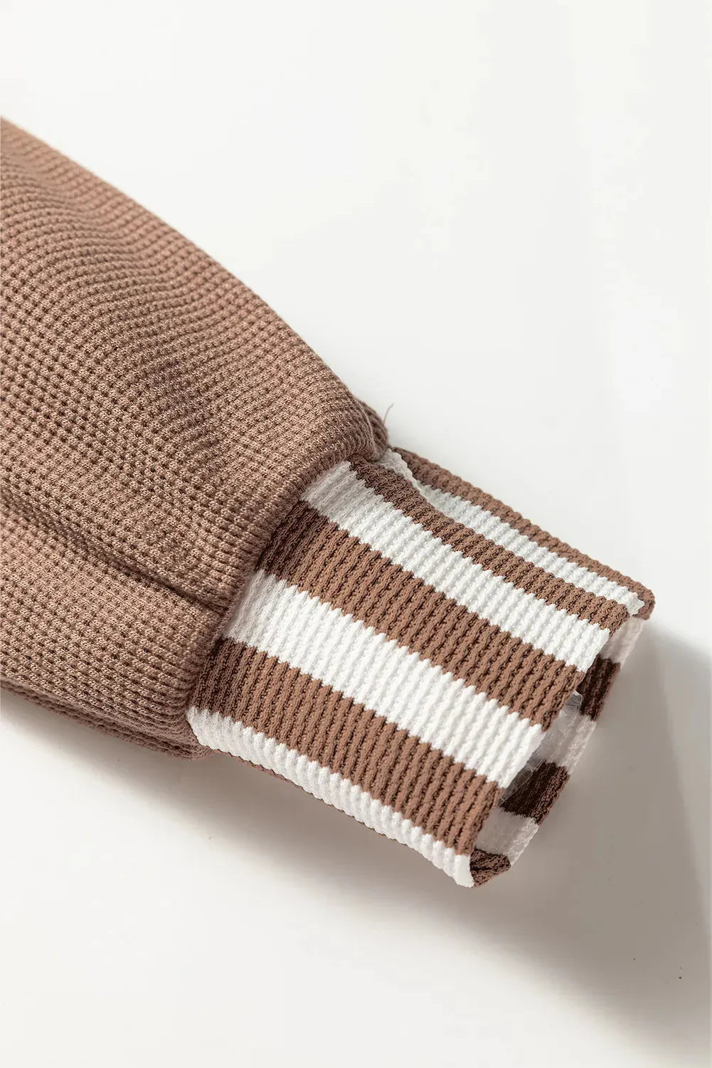 Straw yellow waffle texture hoodie with striped patchwork and a button neck.