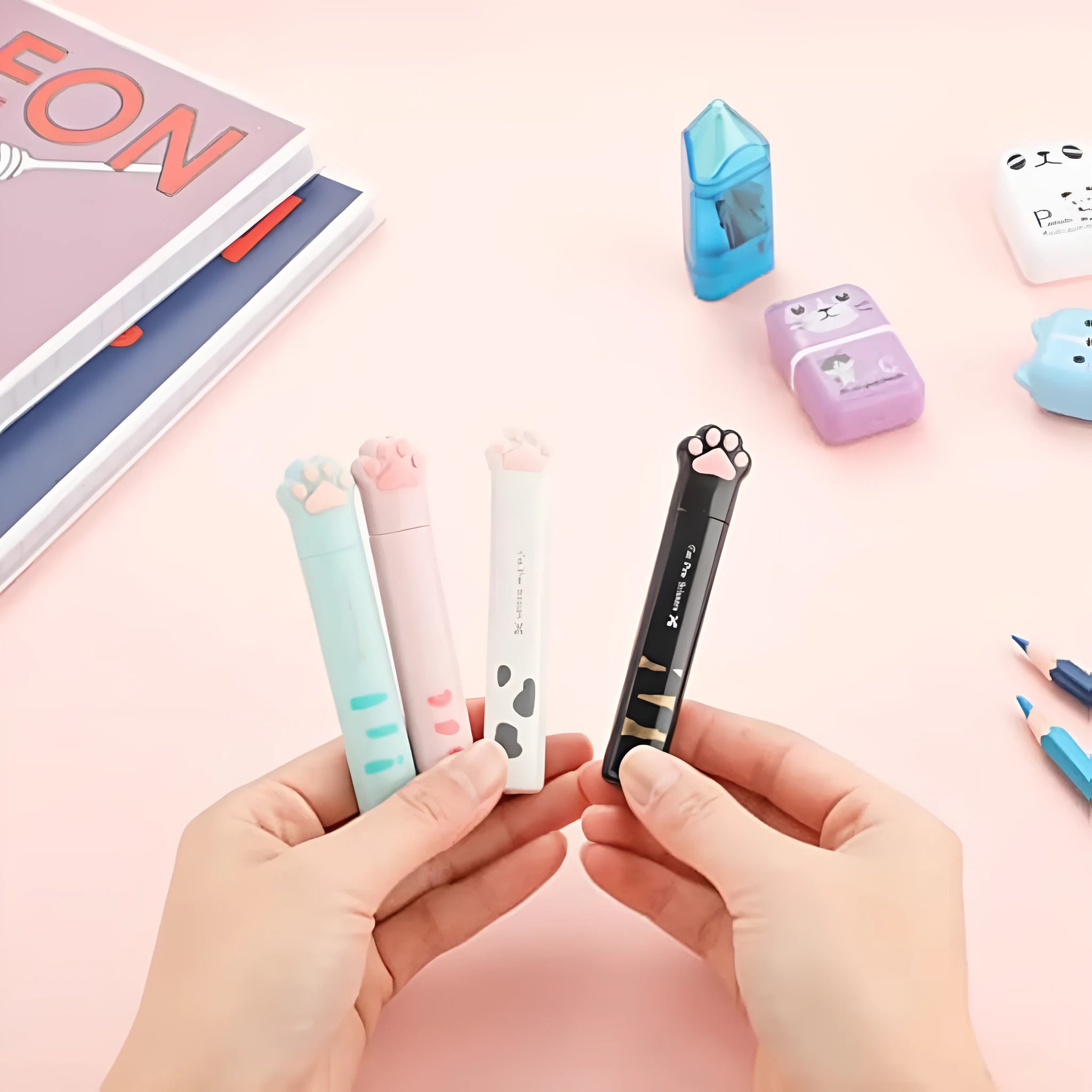 Cat paw mini folding scissors in pink, white, black and blue colours showing compact 8.7 cm size