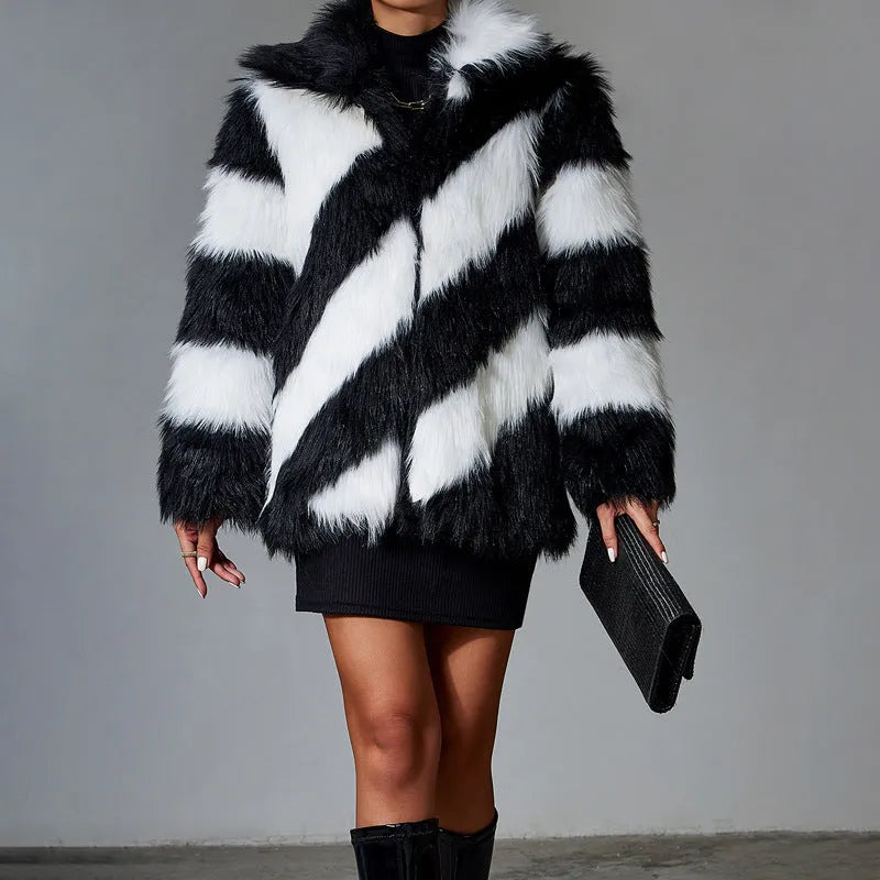 Women's faux fur coat with contrast colour lapel and matching fur collar on a model.