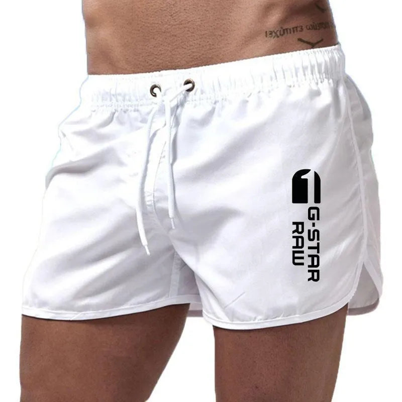 Men's thin hemp-blended polyester sport shorts in multiple colours on a mannequin, showing elastic waistband.