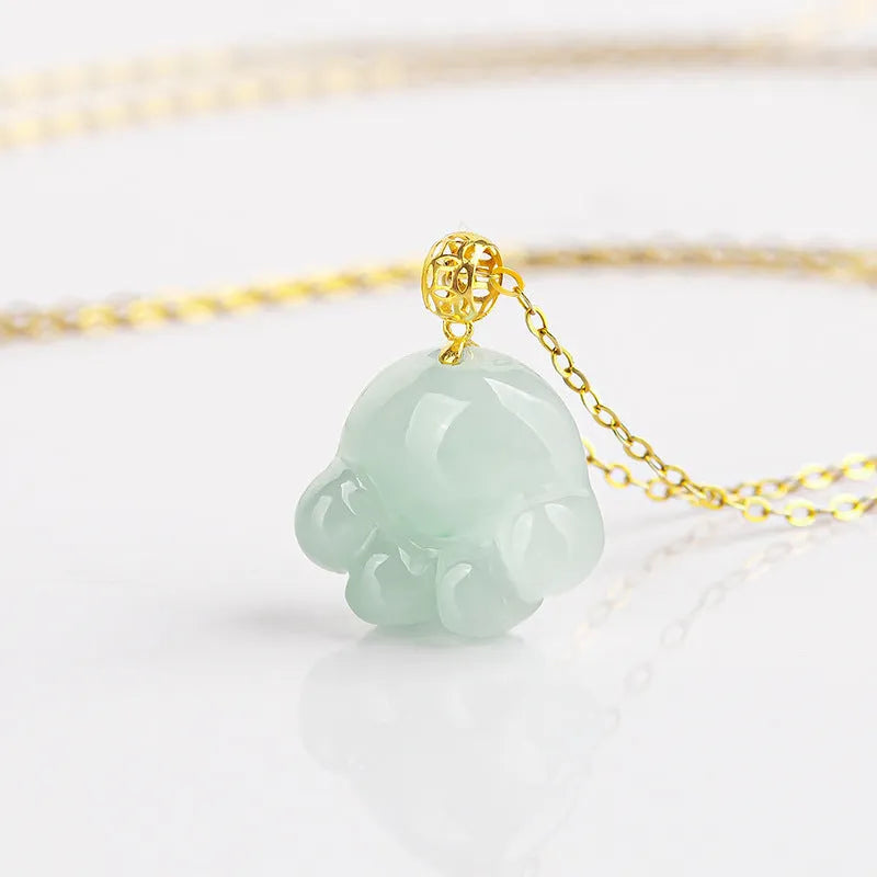 Emerald light green jade cat's paw pendant with 18K gold buckle and certificate on a white background