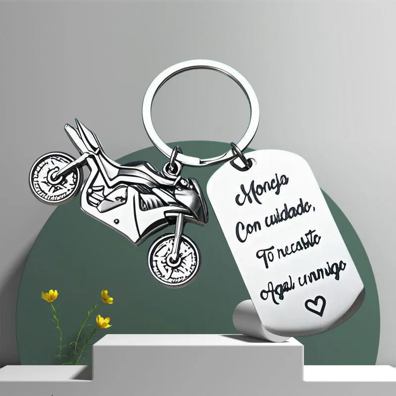 Stainless steel motorcycle keychain with modern design and included flannel gift bag.
