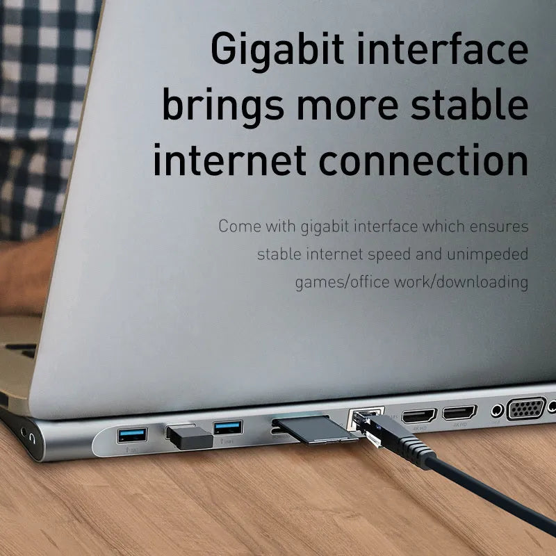 Grey aluminium ten-port docking station with cooling bracket showing HDMI, VGA, USB and network ports