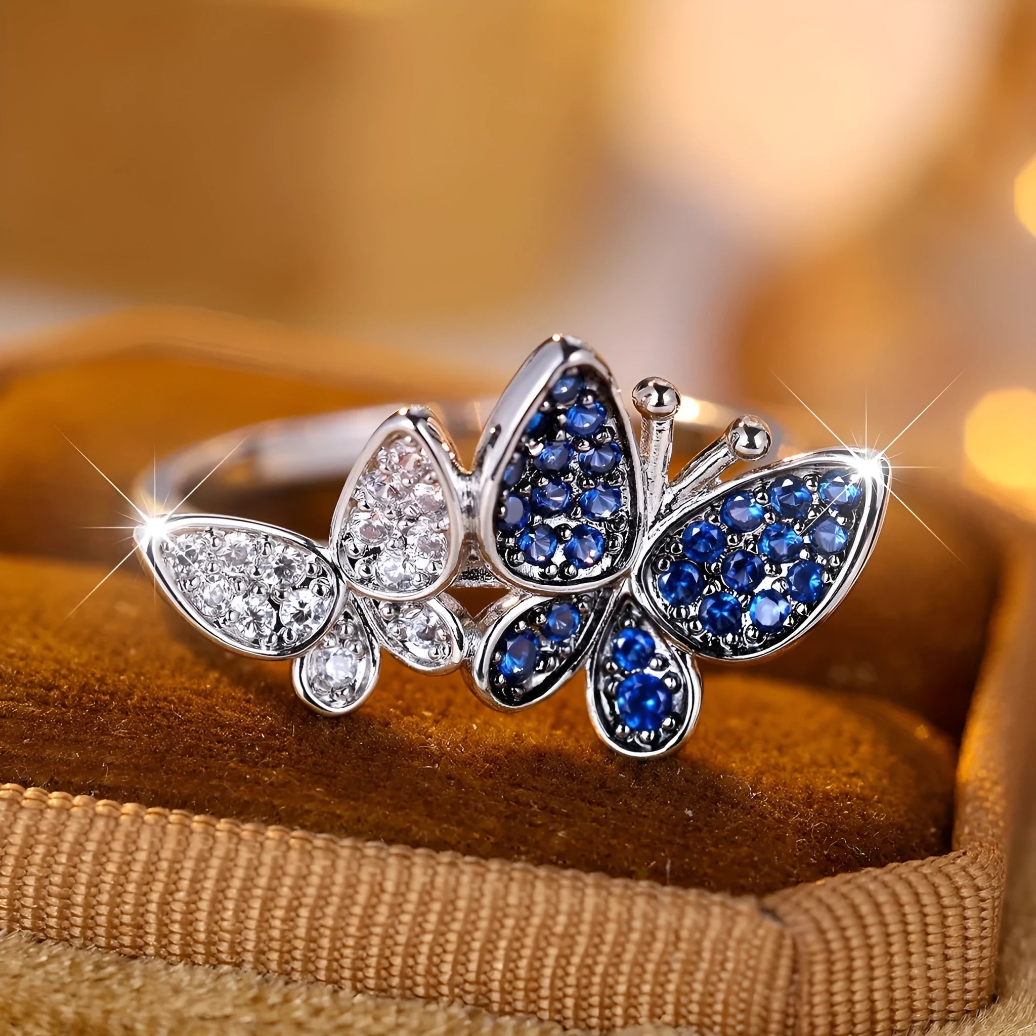 Blue and white butterfly design ring for women on a copper band, showing side detail.