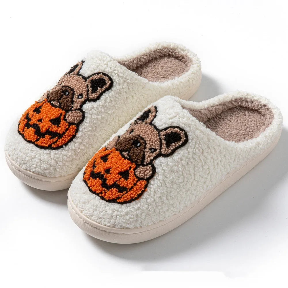 Black and white Halloween plush slippers with pumpkin pattern and non-slip rubber soles.