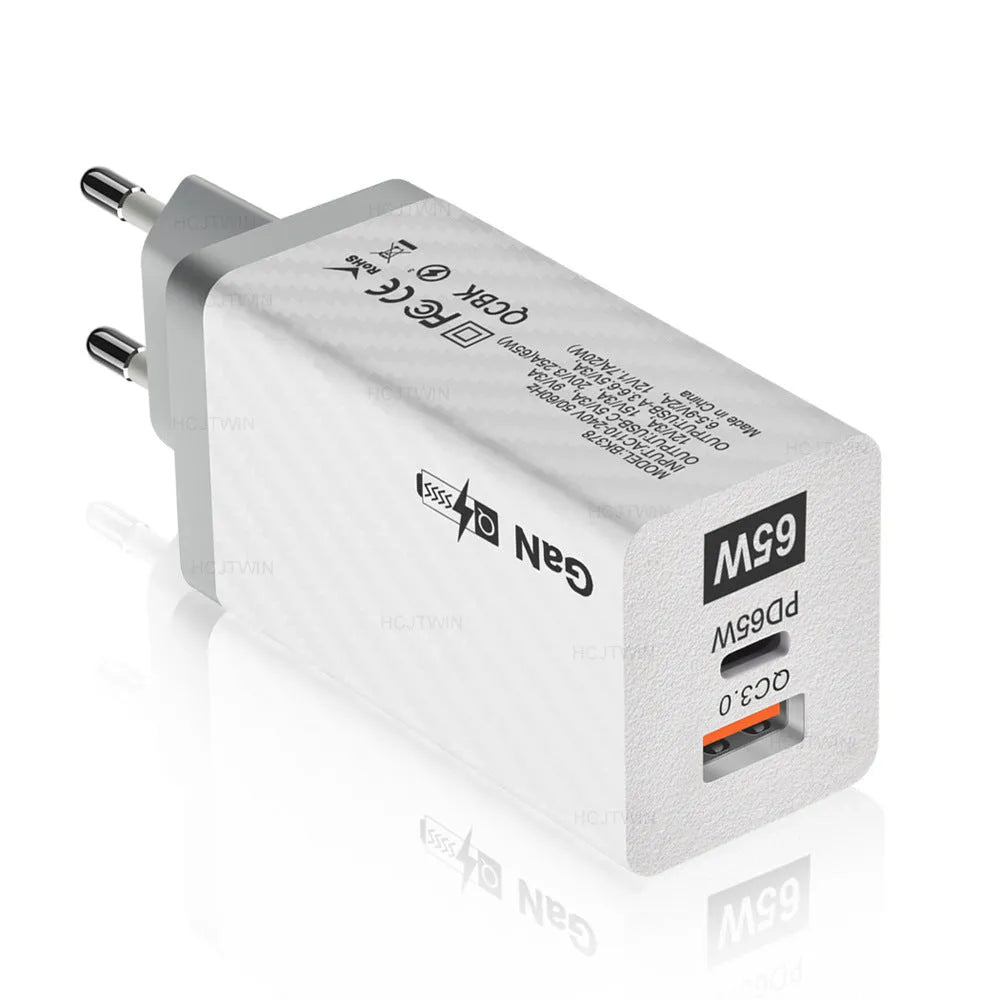 65W GaN universal laptop charger with UK, US, and EU plug heads in black or white