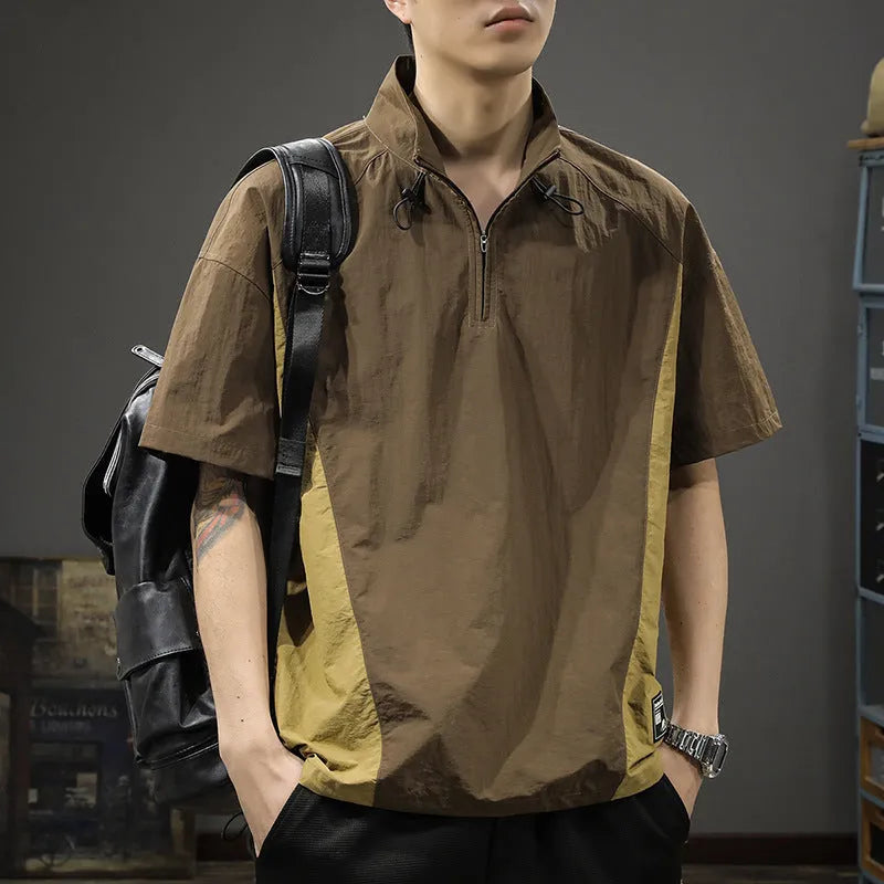 Man modelling a brown half-zip stand collar casual shirt with short sleeves.