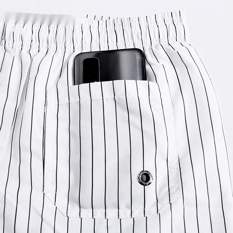 Men's quick-drying beach pants with white stripes, loose plus size, built-in lining, side view