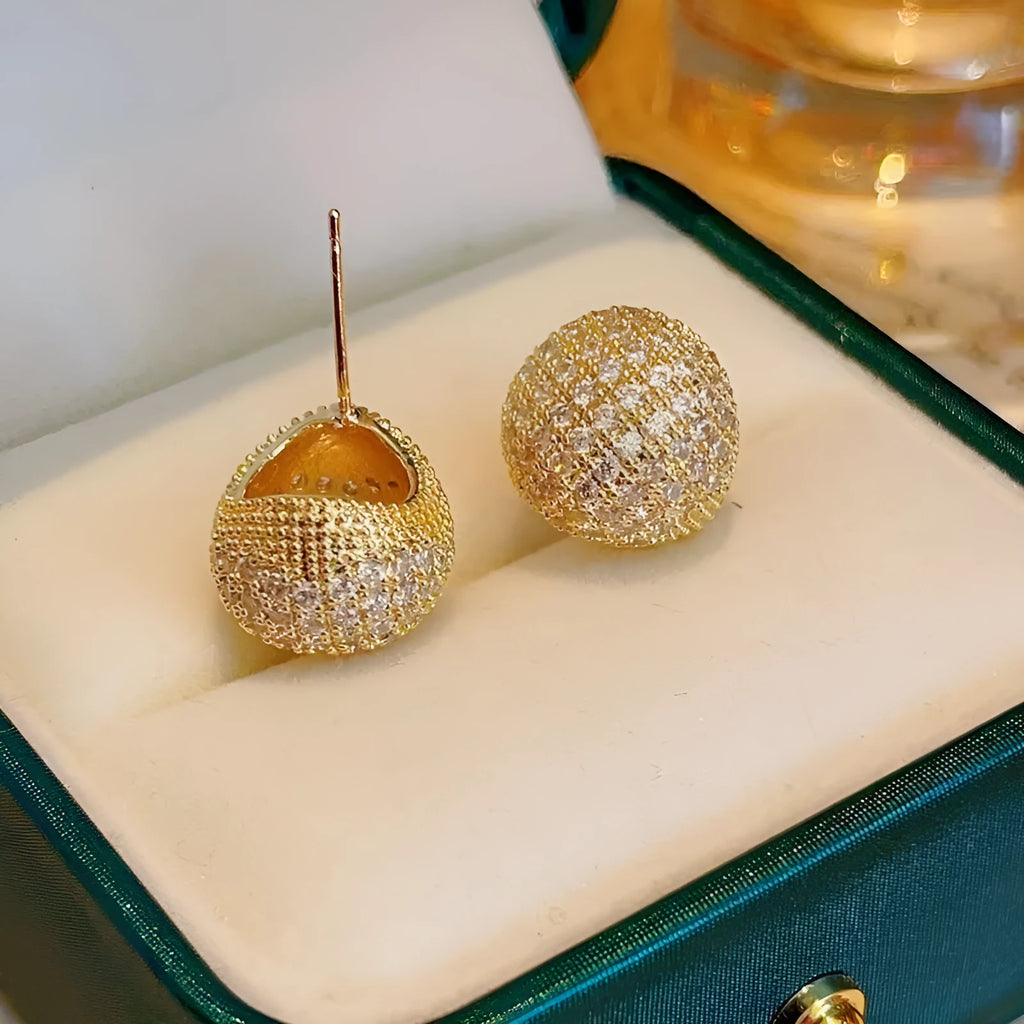 Golden bean earrings with diamond-cut detailing and ear clip fastening in drop shape