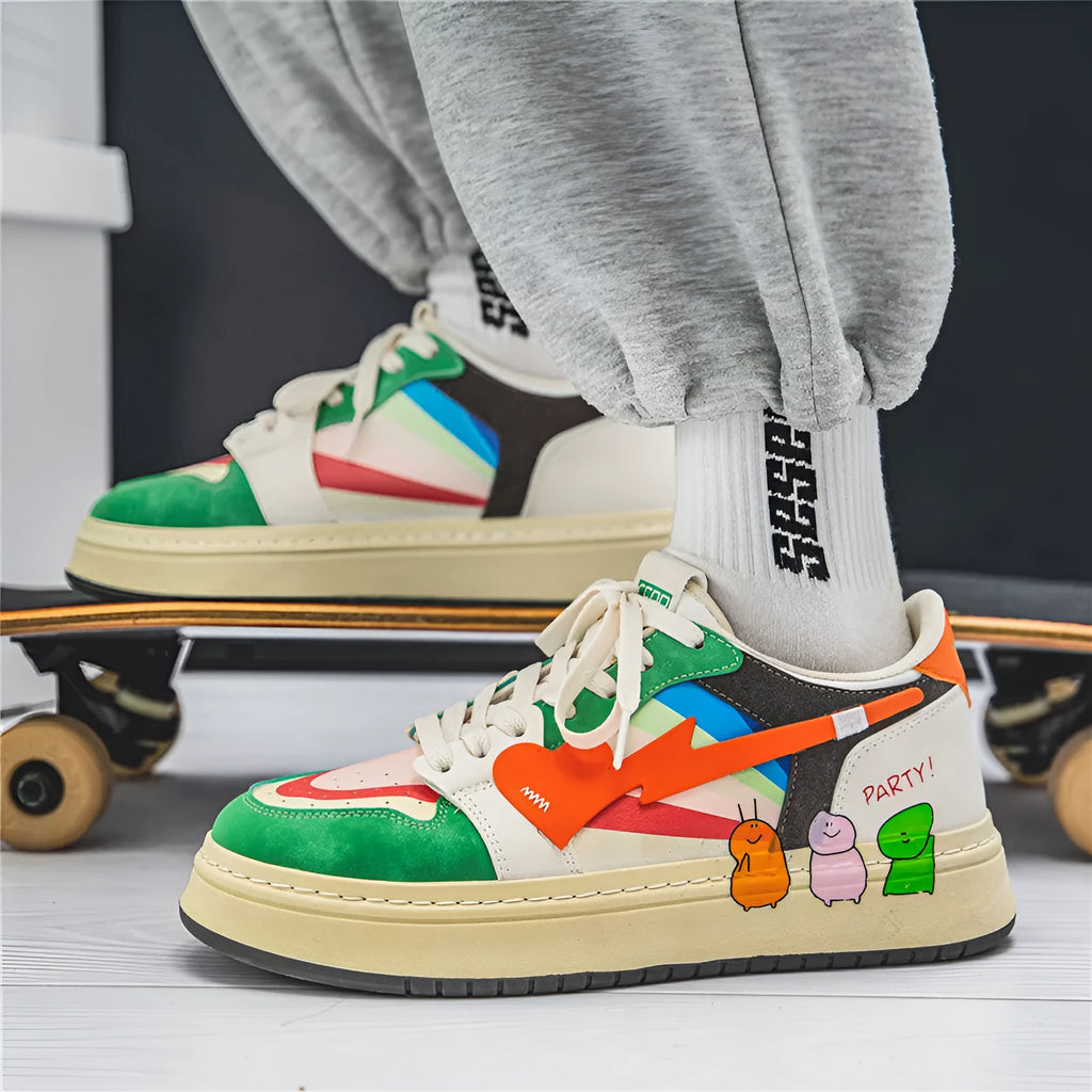 A pair of simple plain sneakers with rainbow colour accents and white laces on a white background.