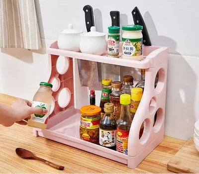 Foldable kitchen storage rack with multilayer shelves in white colour on countertop
