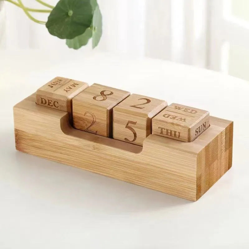 Solid wood simple modern calendar desk sign in natural wood colour on a desk.