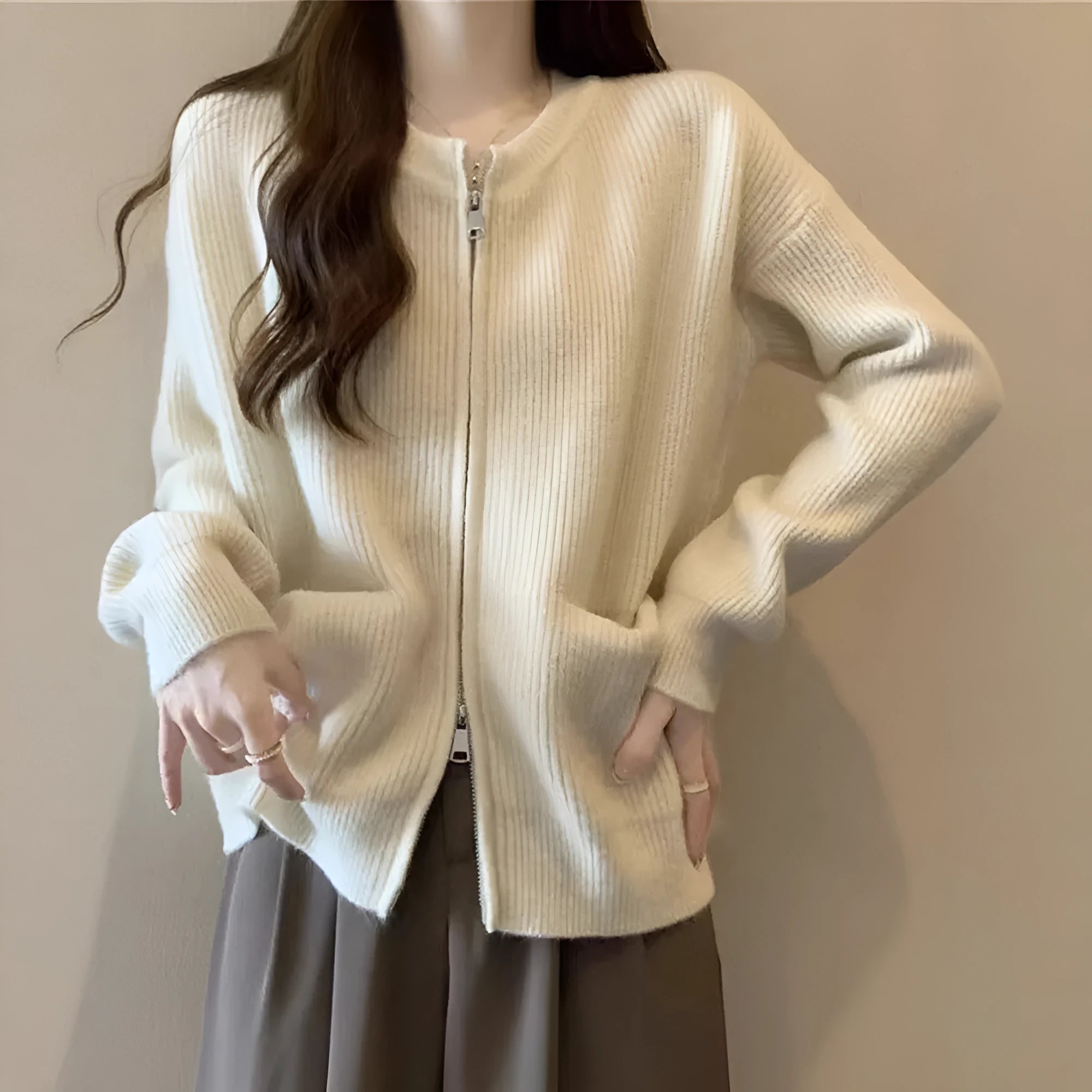 Beige viscose soft wind sweater coat, a long sleeve cardigan laid flat.