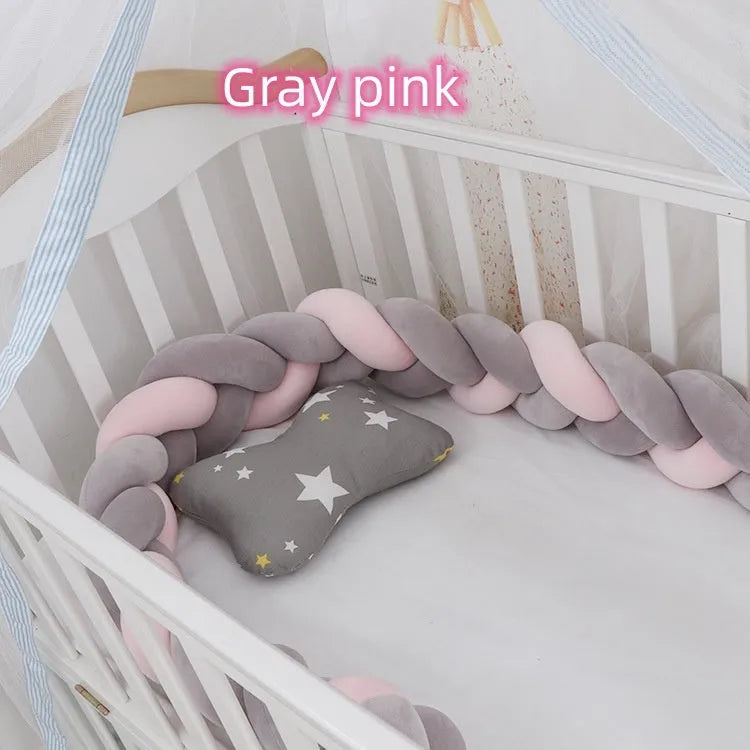 Baby crib bumper protector in spandex velvet, bent to show flexible shape, against a crib rail.