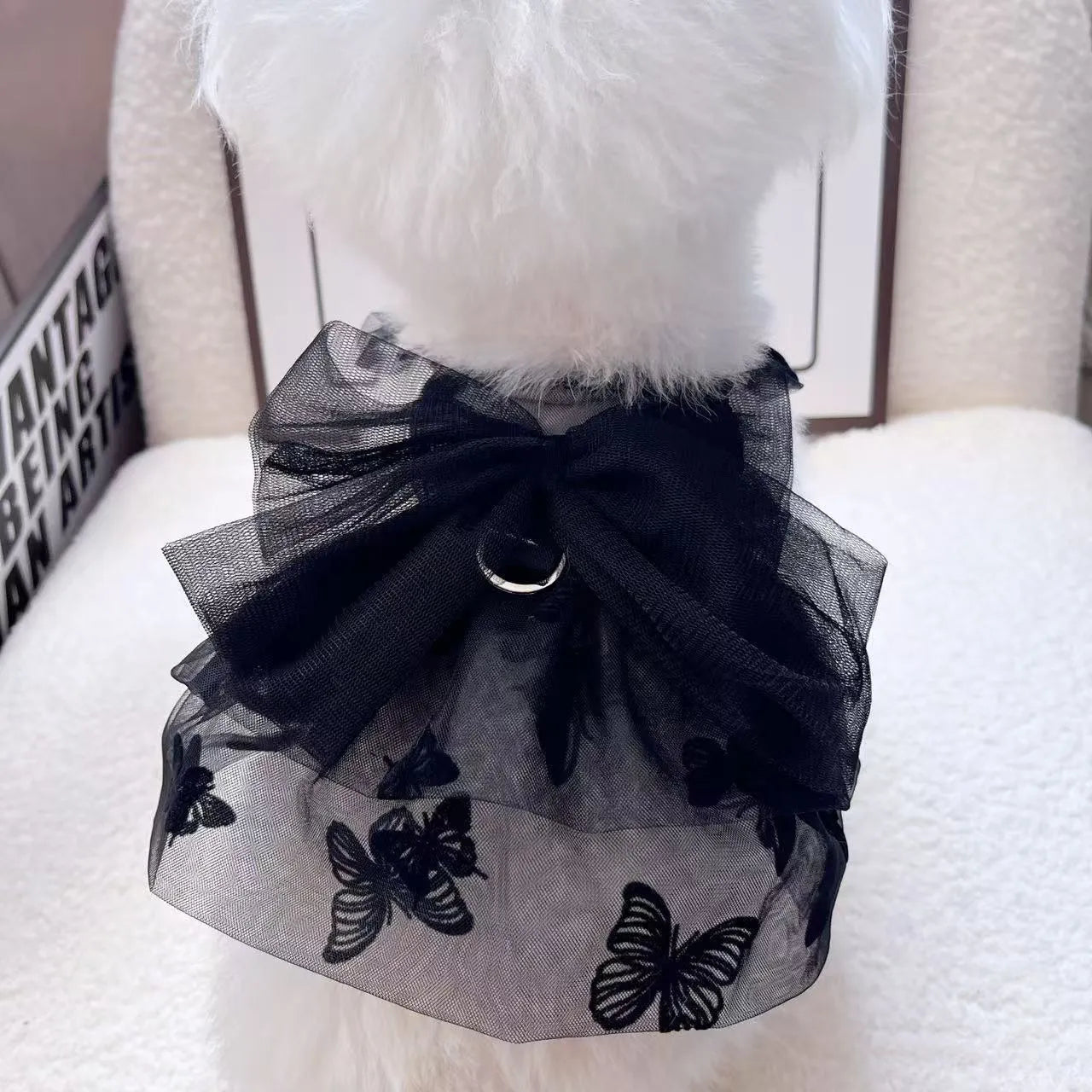 Black gauze princess skirt for a small dog on a mannequin, showing tulle material.