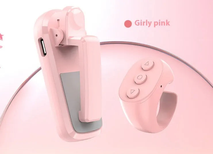Wireless page turner remote control with clicker attachment in black, white, or pink colour.