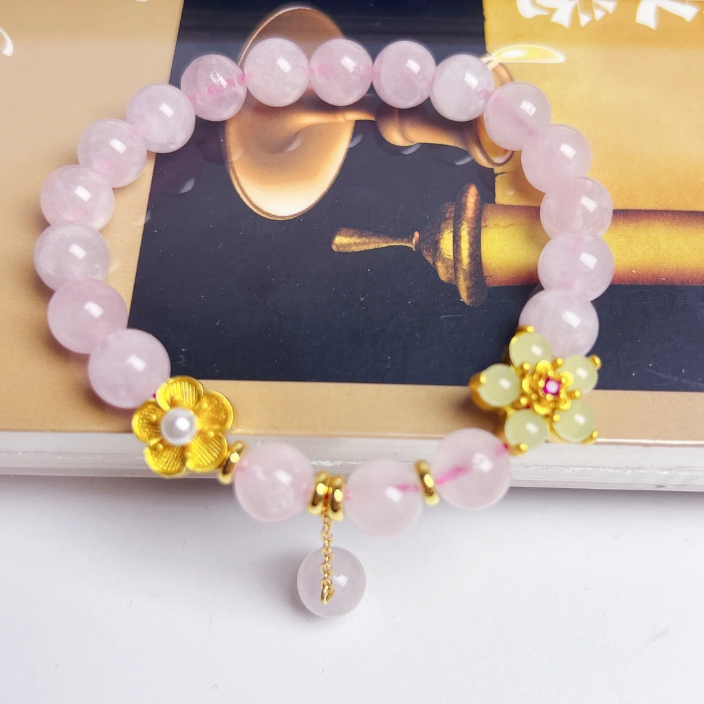 Pink crystal NAFU Peach Blossom bracelet for women on wrist.