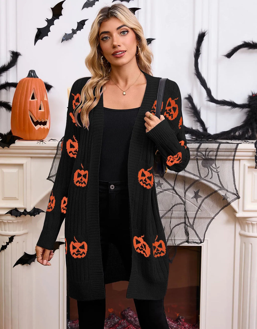Women's black Halloween pumpkin head jacquard knitted cardigan sweater on hanger