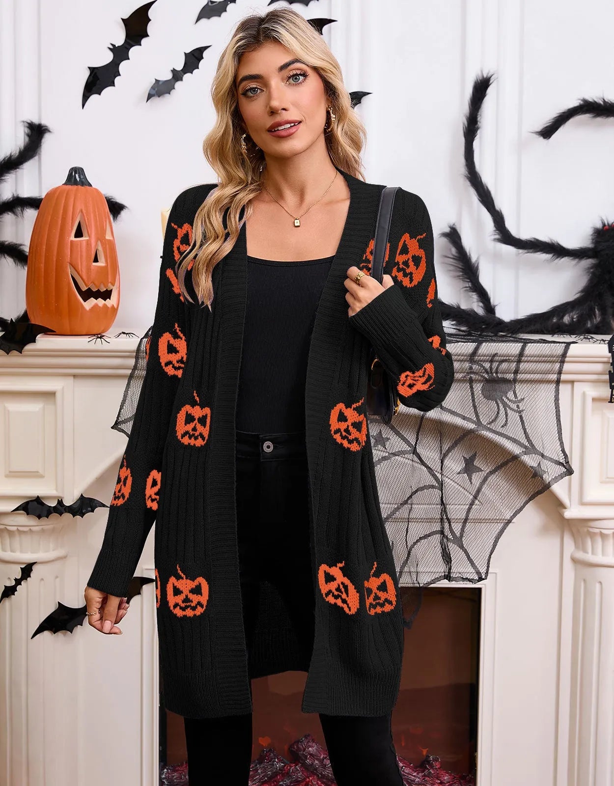 Women's black Halloween pumpkin head jacquard knitted cardigan sweater on hanger